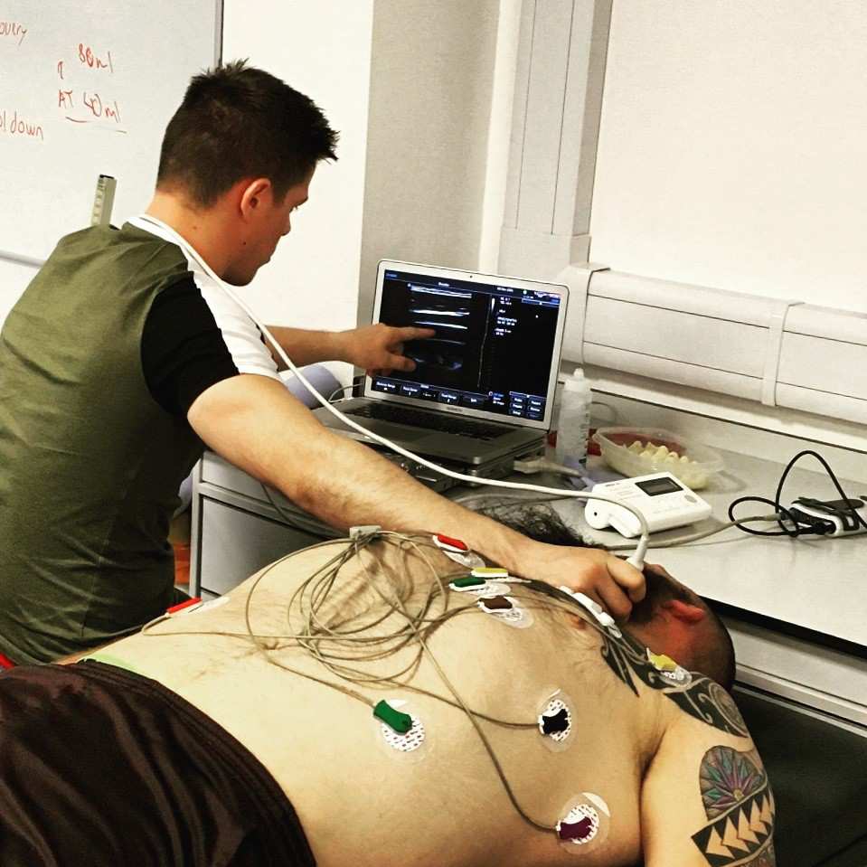Benjamin Stacey performing a carotid ultrasound scan on a Brazilian Jiu Jitsu Athlete.jpg