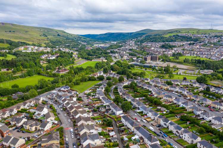 Aerial drone view of a residential area of a small Welsh town surrounded by hills (Ebbw Vale, South Wales, UK) - stock photo GettyImages-1254433127.jpg