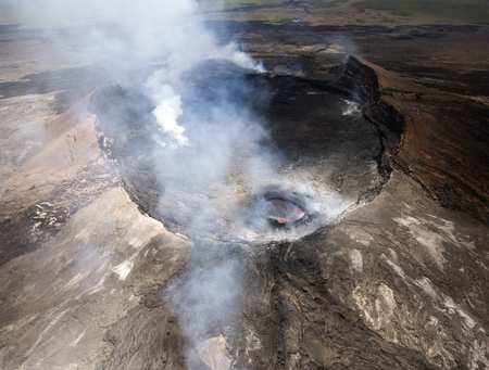 Aerial view of Pu'u O'o crater on the Big Island of Hawaii, June 2012. Although the crater was relatively inactive at this time, the bubbling lava can be seen inside a smaller area of the immense crater. GettyImages-155601319.jpg